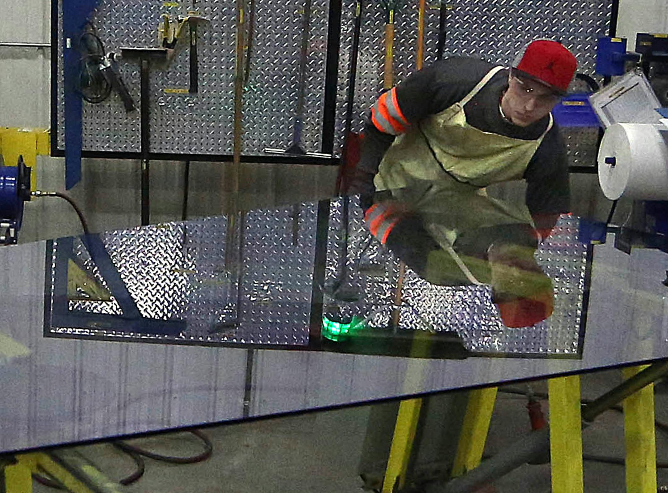 In February, Viracon worker Matt Smith prepared a panel of glass for shipping from Owatonna to the new Vikings Stadium.