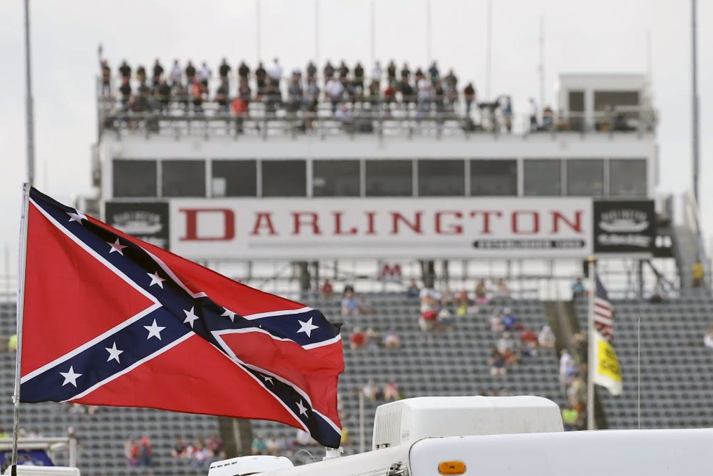 A Confederate flag flies in the infield before a NASCAR Xfinity auto race at Darlington Raceway in 2015.