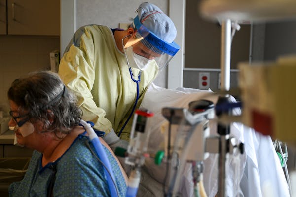 North Memorial critical care nurse Monica Lindblad worked with COVID-19 patient Melody Biggar, of Robbinsdale, on Thursday, Sept. 3, 2020 in Robbinsda