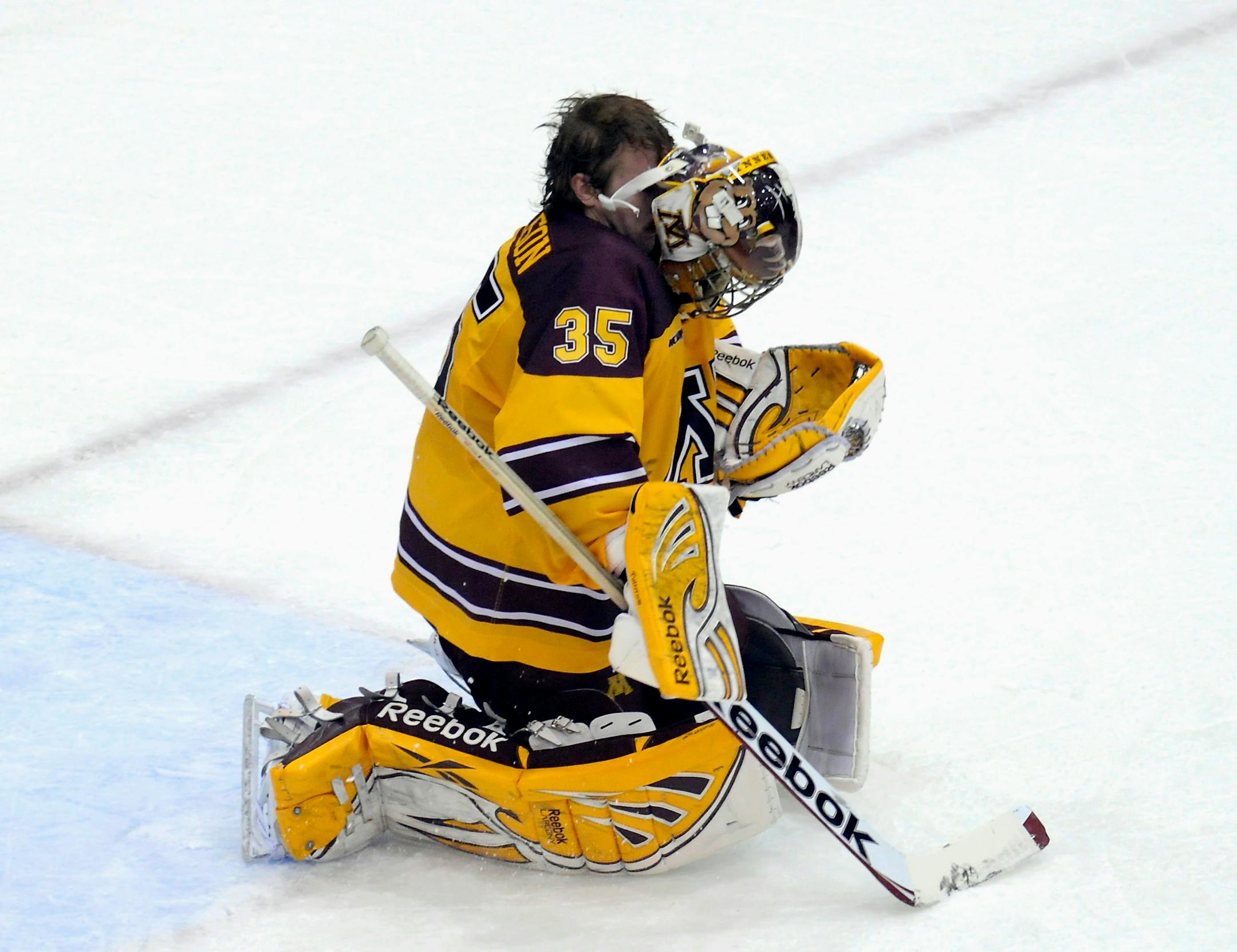 Gophers goalie Kent Patterson's mask fell off after being hit by a flying puck in the second period Saturday night.