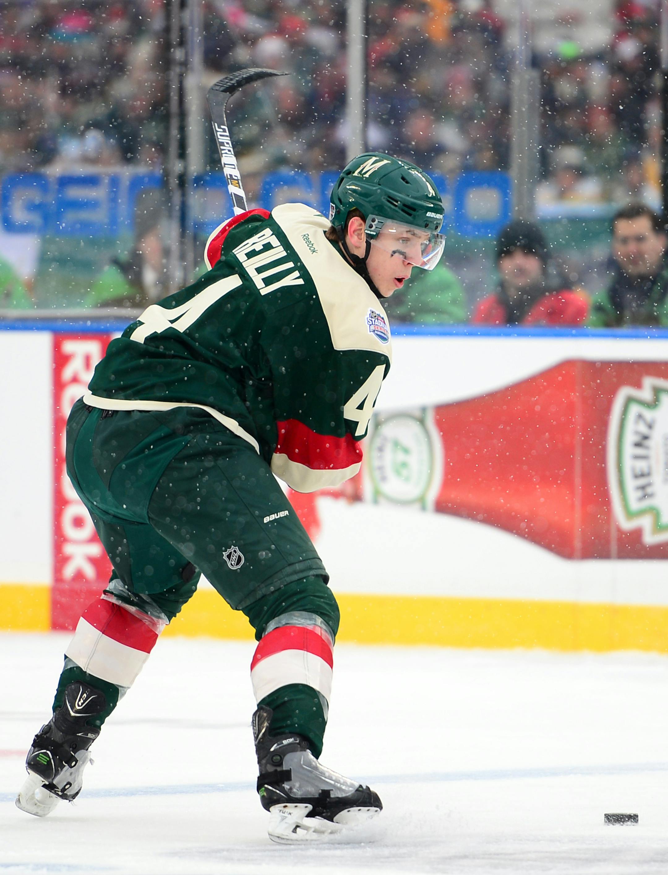 Minnesota Wild defenseman Mike Reilly (4) took a slap shot against Chicago Blackhawks in the first period Sunday. ] (AARON LAVINSKY/STAR TRIBUNE) aaron.lavinsky@startribune.com The 2016 Coors Light NHL Stadium Series game between the Minnesota Wild and the Chicago Blackhawks was held Sunday, Feb. 21, 2016 at TCF Bank Stadium in Minneapolis, Minn.