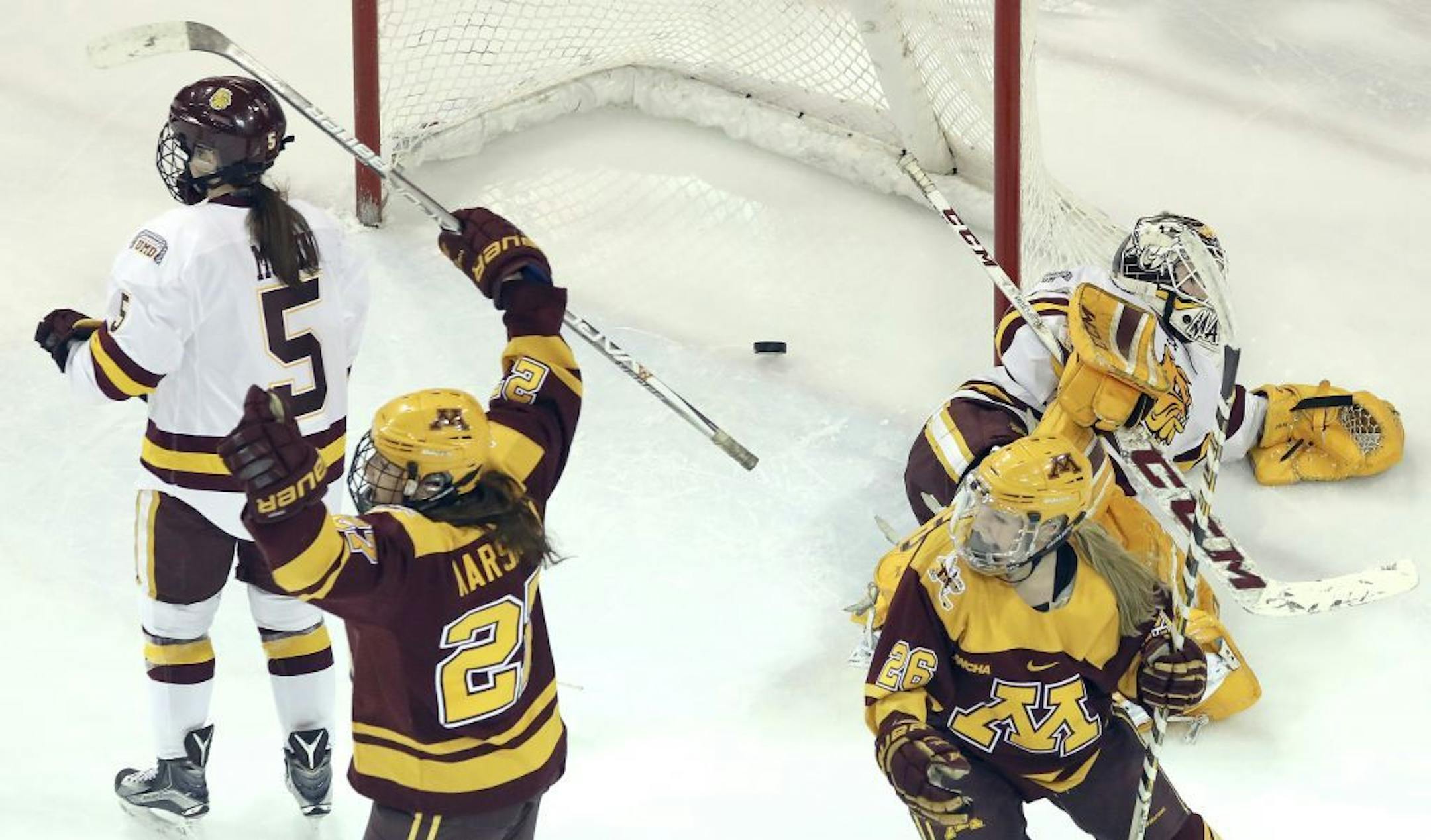 T03.10.2017 -- Steve Kuchera -- 031117.S.DNT.UMDwpuxC1-- Minnesota�s Patti Marshall lifts her arms in celebration after putting the puck past Duluth goaltender Maddie Rooney for the only score in Saturday�s game at Duluth. Also picture are Duluth�s Sidney Morin and Minnesota�s Sarah Potomak. Steve Kuchera / skuchera@duluthnews.com