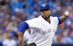 Toronto Blue Jays starting pitcher Francisco Liriano works against the Minnesota Twins during first-inning baseball game action in Toronto, Friday, Au