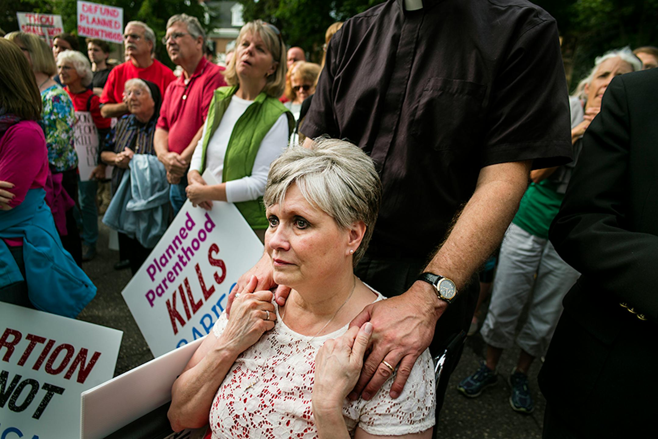 In front of the governor's mansion in St. Paul, pro-life activists gathered to ask Gov. Mark Dayton to investigate Planned Parenthood and calling for legislators to defund the organization. Ramona Porter of Sauk Centre came with her husband Rev. Marty Porter. She held a sign saying "I Regret My Abortion." She said, "it's part of the healing process."