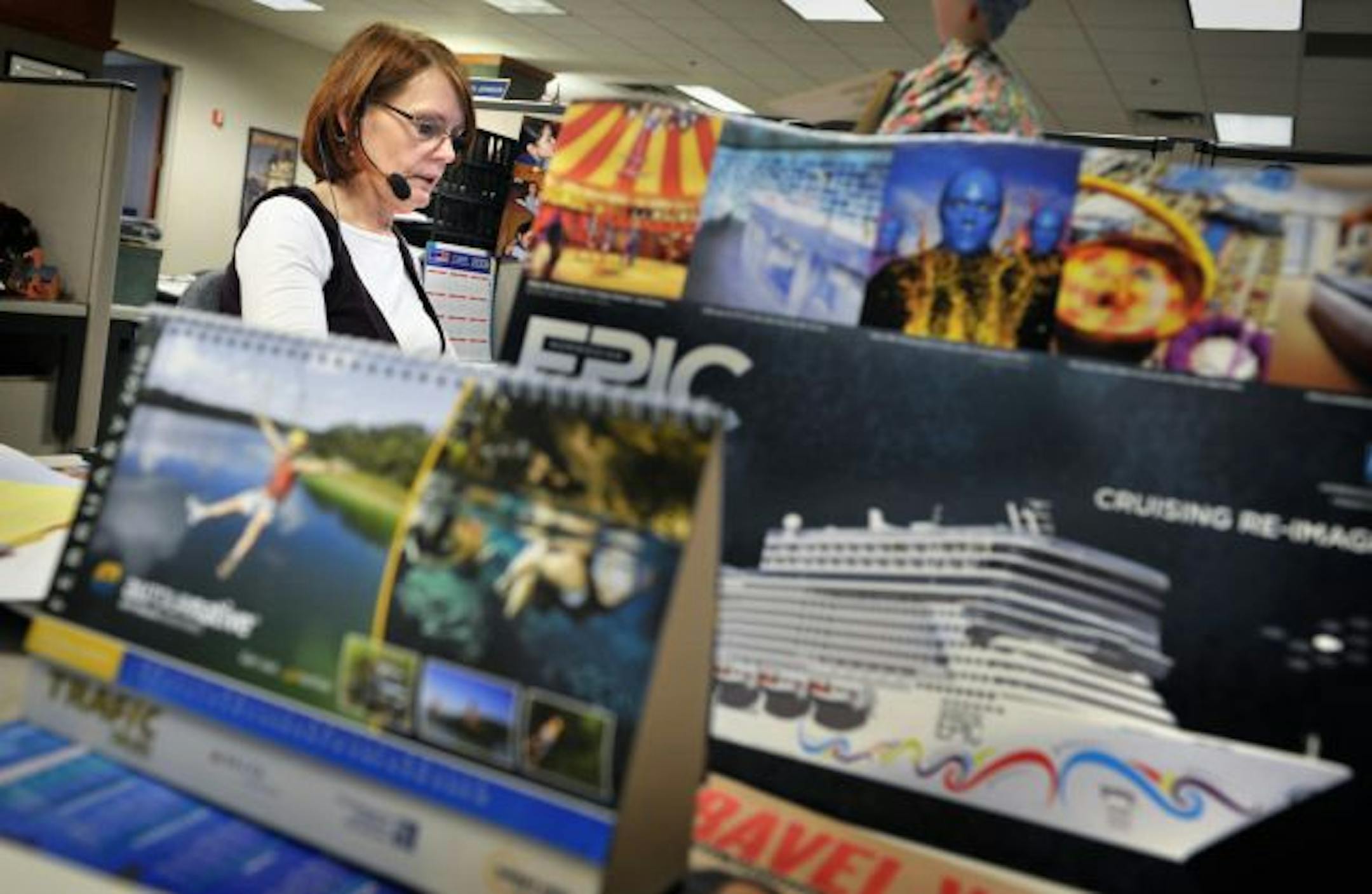 Carolyn (Rae) Johnson talked to a client about rates and options for a cruise to Alaska at Hobbit Travel's Minneapolis call center on Friday. "I sold more cruises this week than I did almost all of last month," Johnson said.