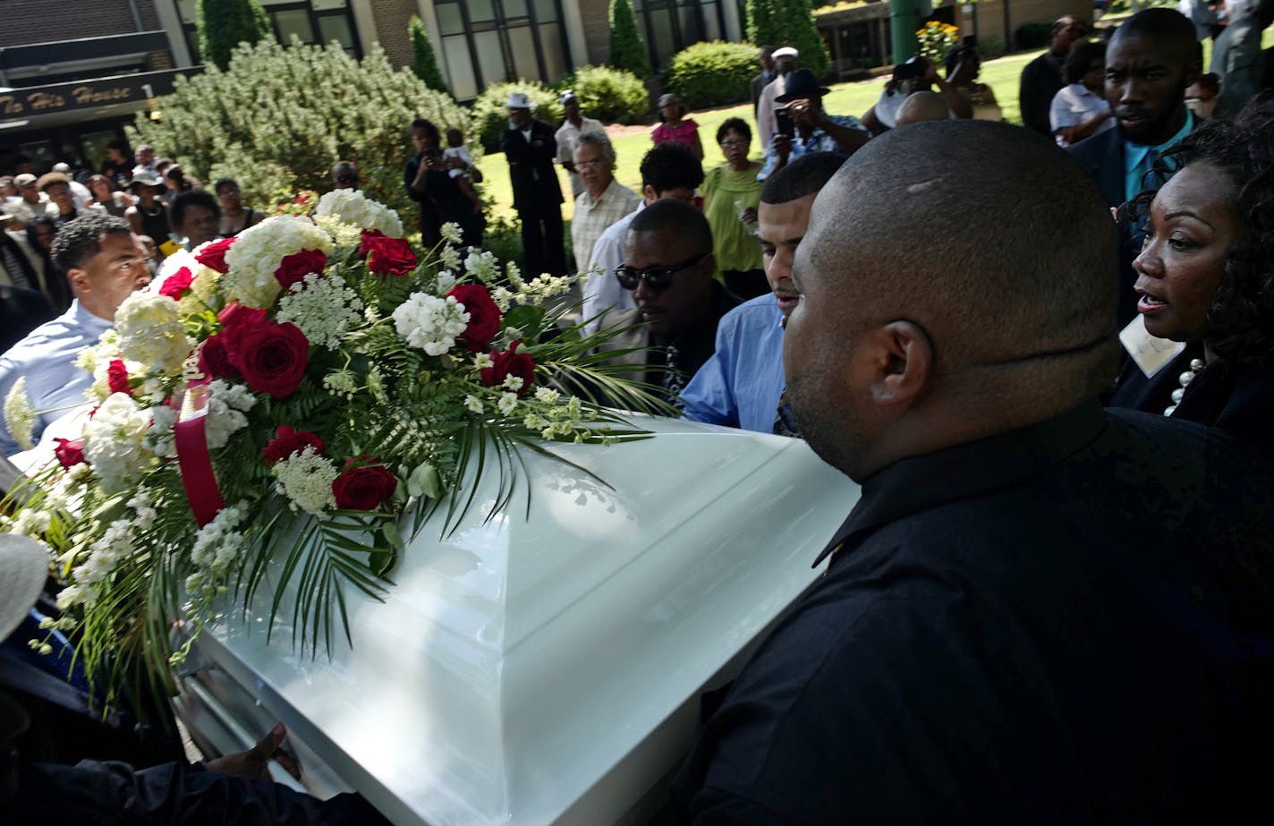 At New Bethel Church, Margaret Brooks, far right, oversees the loading of Stanley Ross's casket unto a horse-drawn carriage. Ross was a well-known and colorful figure in the black community in St. Paul.]Since opening in 1941, Brooks Funeral Home in St. Paul has become a trusted fixture in the black community. Margaret Brooks runs the home with her husband, George and several of the sons. Richard Tsong-taatarii@startribune.com