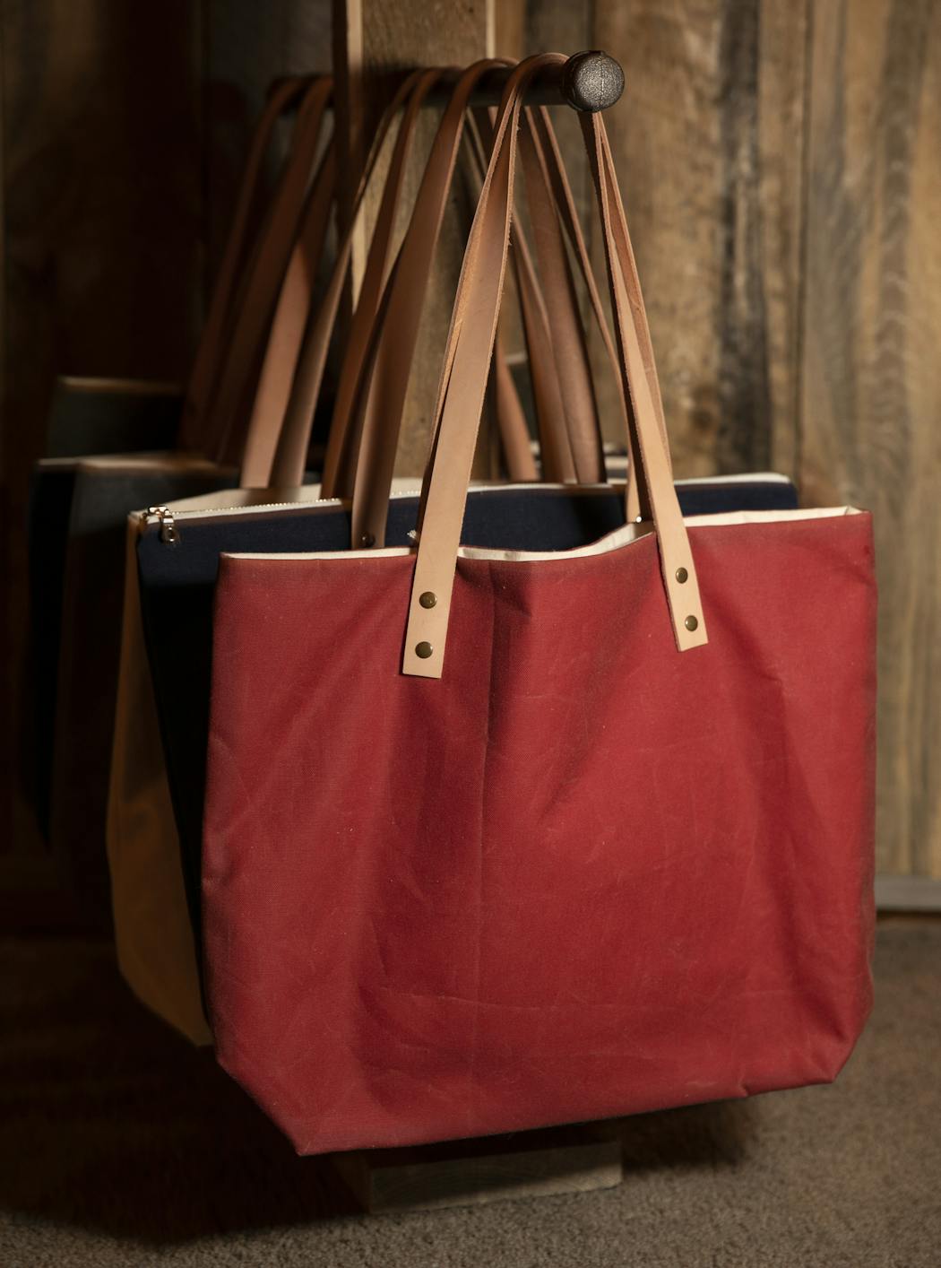 Pictured are the waxed canvas totes.