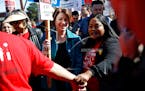 Democratic presidential candidate Sen. Amy Klobuchar, D-Minn., walks on a picket line with members of the Culinary Workers Union Local 226 outside the
