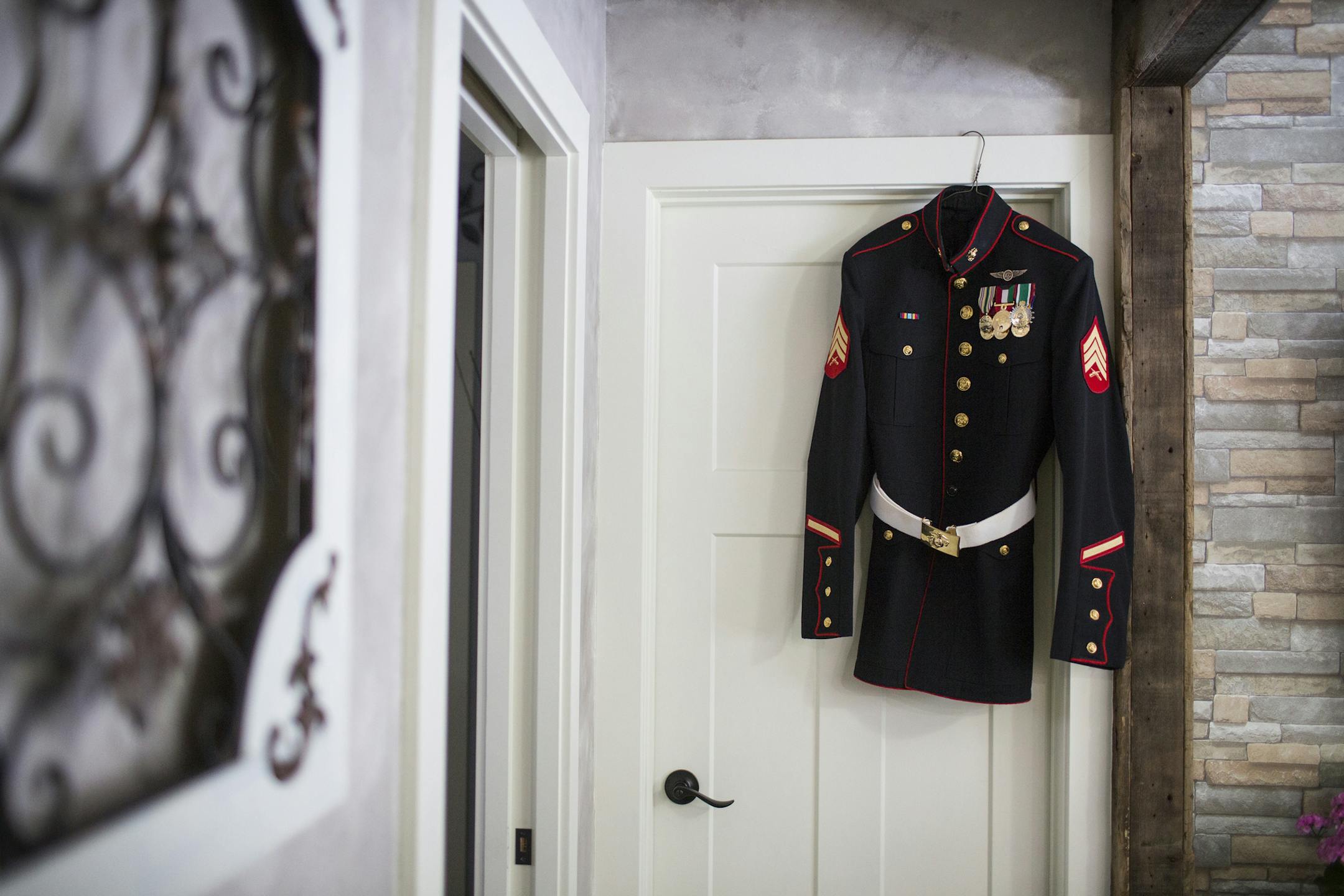 The dress blues that belonged to Dillon Semolina hang in the Bloomington home of his mother and stepfather on Wednesday, February 17, 2016. ] (Leila Navidi/Star Tribune) leila.navidi@startribune.com BACKGROUND INFORMATION: Sgt. Dillon Semolina, 24, of Chaska, Minn. died in a Hawaii helicopter crash on Jan. 14. Semolina was a crew chief with the Marine Heavy Helicopter Squadron.