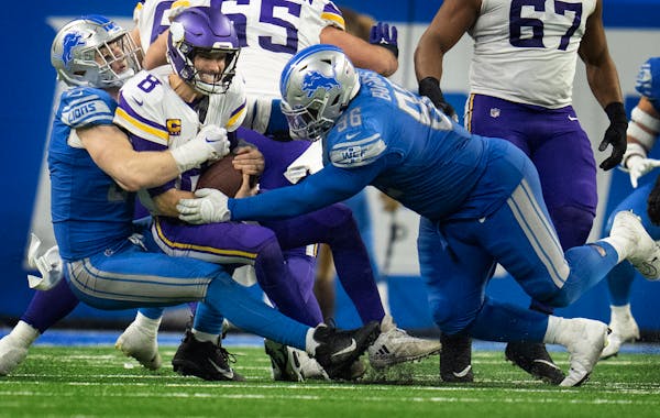  Lions defensive end Aidan Hutchinson, left, helped keep pressure on Kirk Cousins throughout Sunday’s game. 