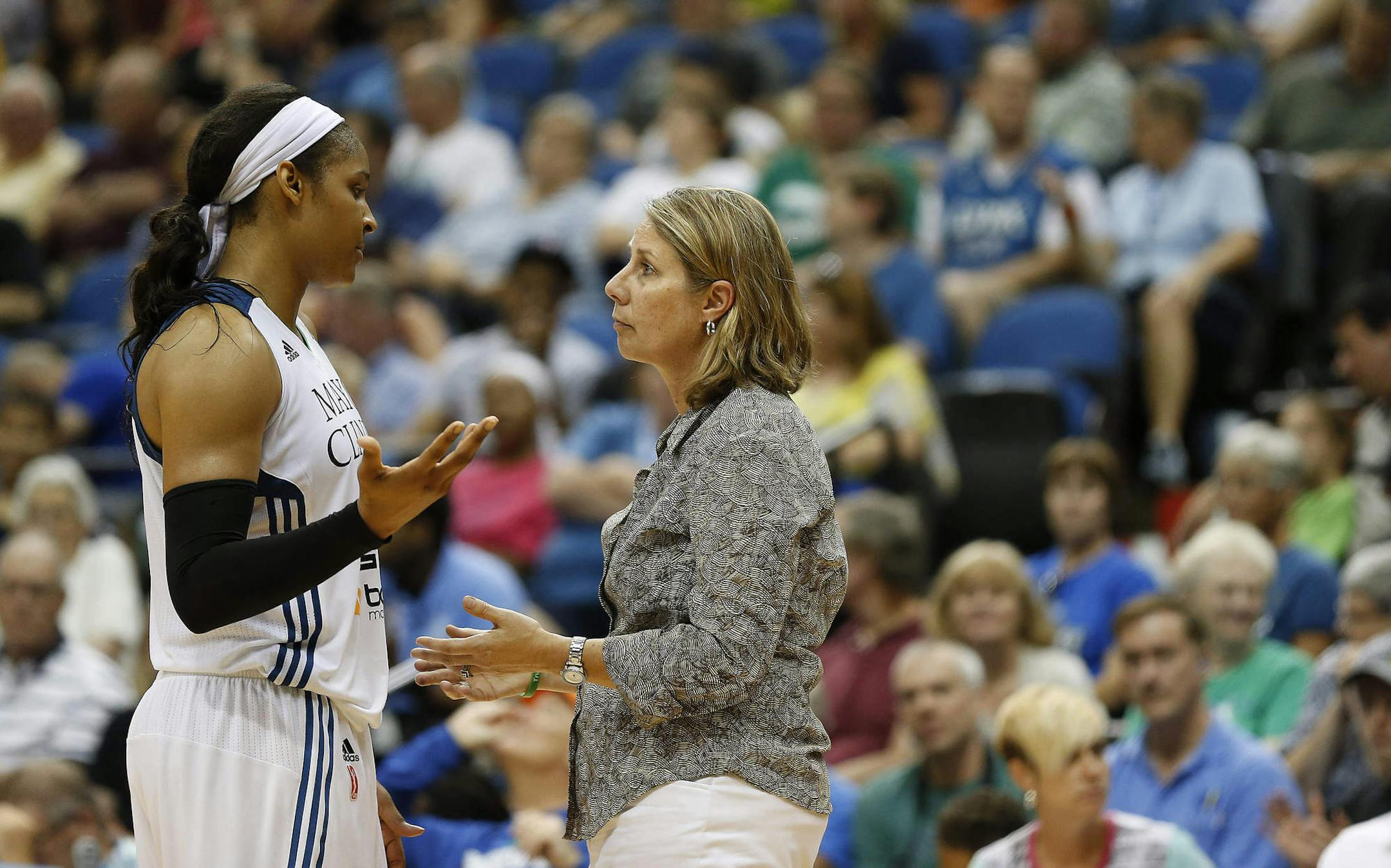 Minnesota Lynx forward Maya Moore (23) talks with head coach Cheryl Reeve during the second half of a WNBA basketball game against the Connecticut Sun, Wednesday, July 22, 2015, in Minneapolis. The Sun won 78-77 in overtime. (AP Photo/Stacy Bengs)