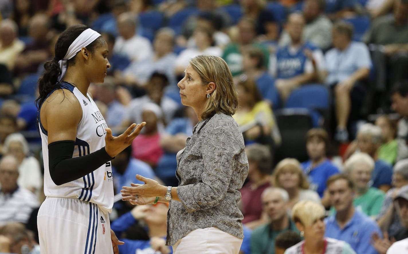 Minnesota Lynx forward Maya Moore (23) talks with head coach Cheryl Reeve during the second half of a WNBA basketball game against the Connecticut Sun, Wednesday, July 22, 2015, in Minneapolis. The Sun won 78-77 in overtime. (AP Photo/Stacy Bengs)