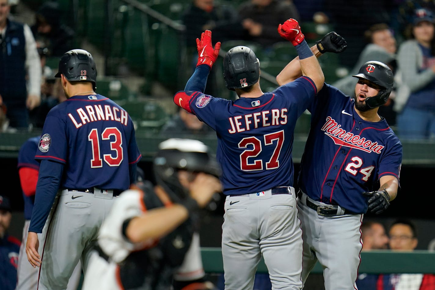 The Twins' Ryan Jeffers is greeted near home plate by Gary Sanchez after Jeffers scored Sanchez, Trevor Larnach and himself on three-run home run against the Orioles during the sixth inning