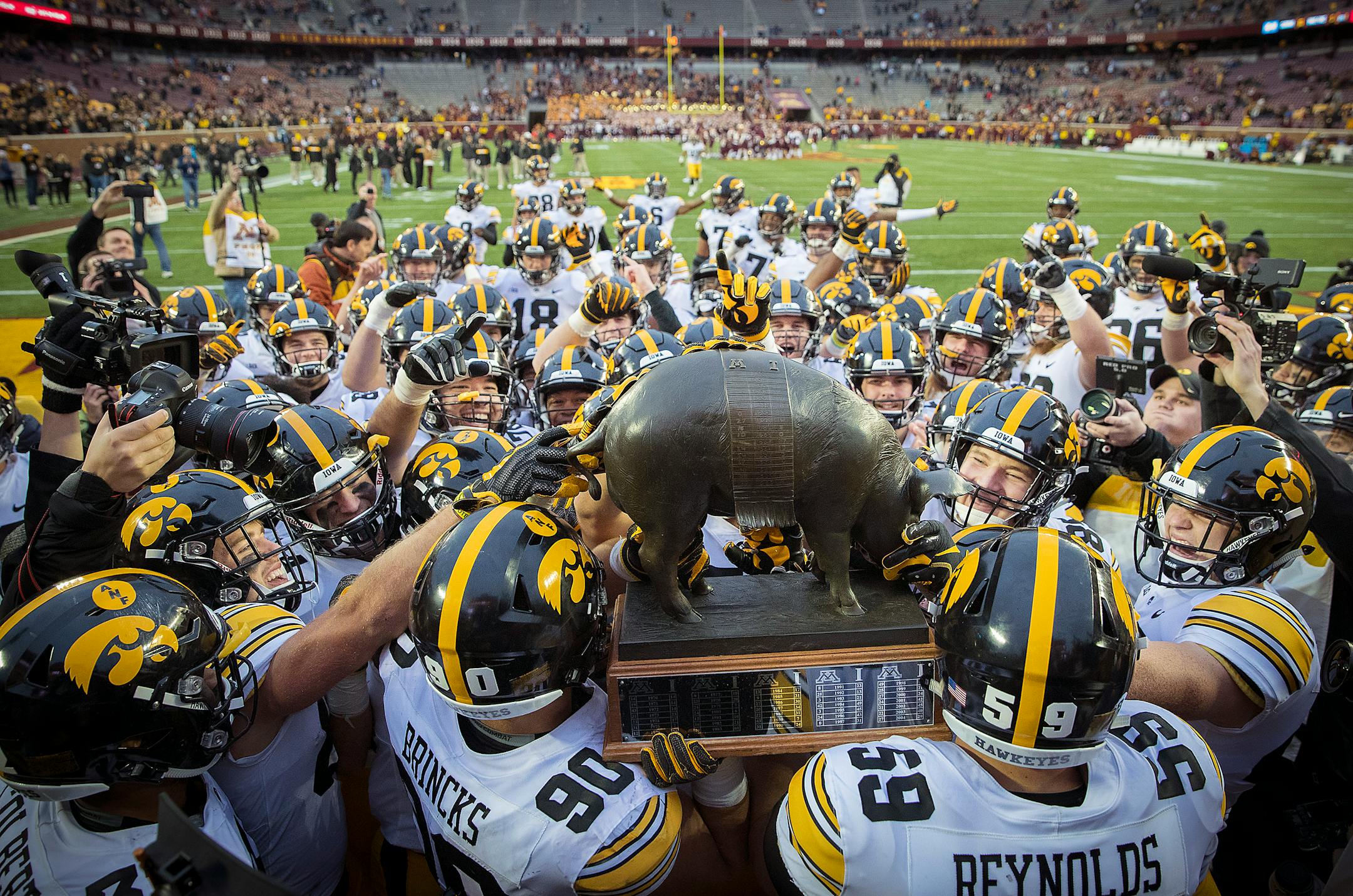 The "Floyd of Rosedale Trophy" will remain in Iowa as the players made their way to lift it in celebration after they defeated Minnesota 48-31