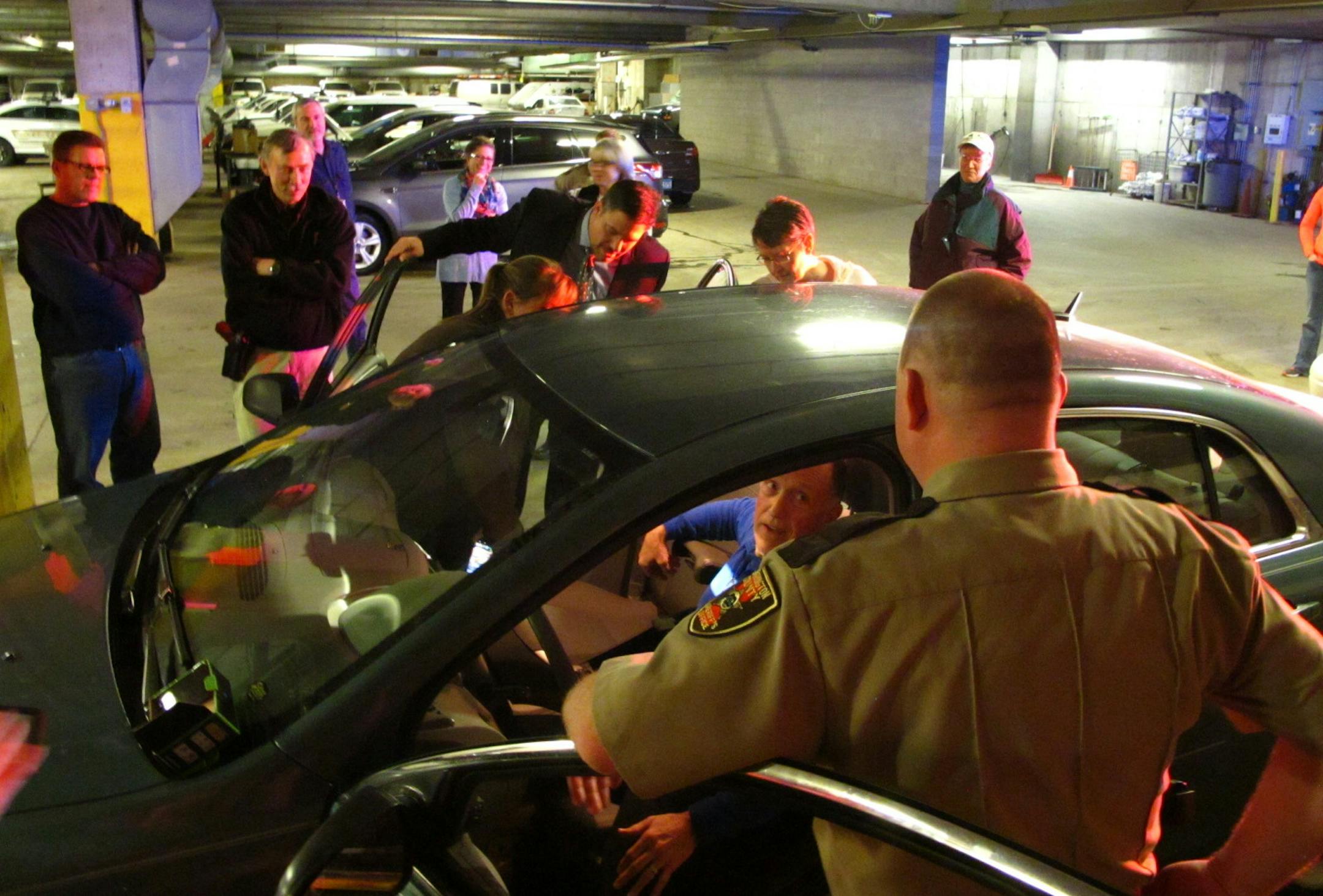 Richard Brainerd, inside the car, participates in a traffic stop roleplay where officers found jewelry stolen in a burglary and then, drugs and a handgun. Deputy Mark Rindfleisch, in the foreground, was the academy instructor.