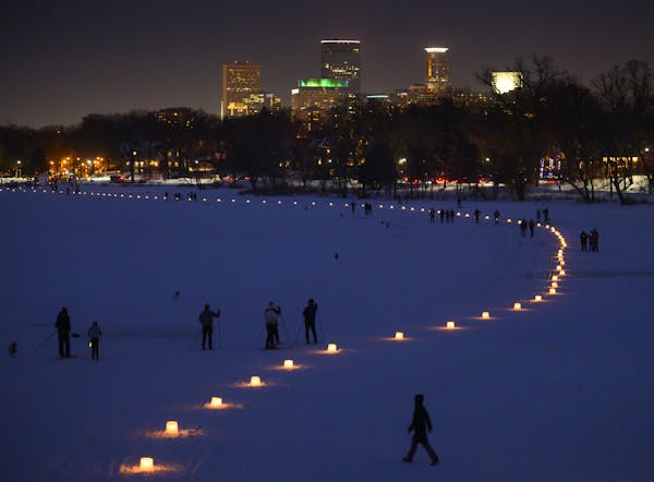 The candle-lit path on Lake of the Isles Saturday night during the Luminary Loppet. ] Aaron Lavinsky • aaron.lavinsky@startribune.com The annual Lum