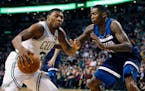 Minnesota Timberwolves' Jamal Crawford (11) defends against Boston Celtics' Marcus Smart (36) during the second quarter of an NBA basketball in Boston