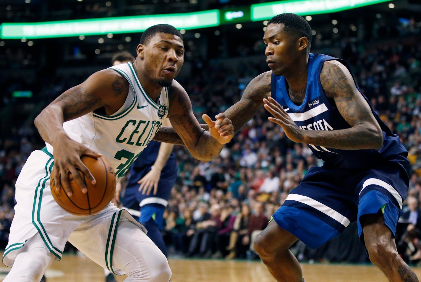 Minnesota Timberwolves' Jamal Crawford (11) defends against Boston Celtics' Marcus Smart (36) during the second quarter of an NBA basketball in Boston, Friday, Jan. 5, 2018. (AP Photo/Michael Dwyer)