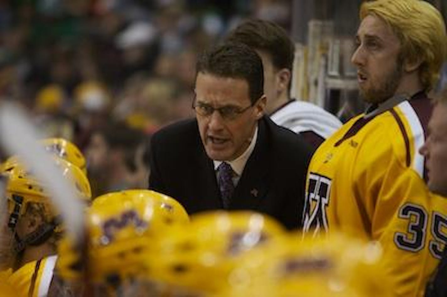 Mike Guentzel returned to the Gophers men's hockey team Wednesday as associate head coach.