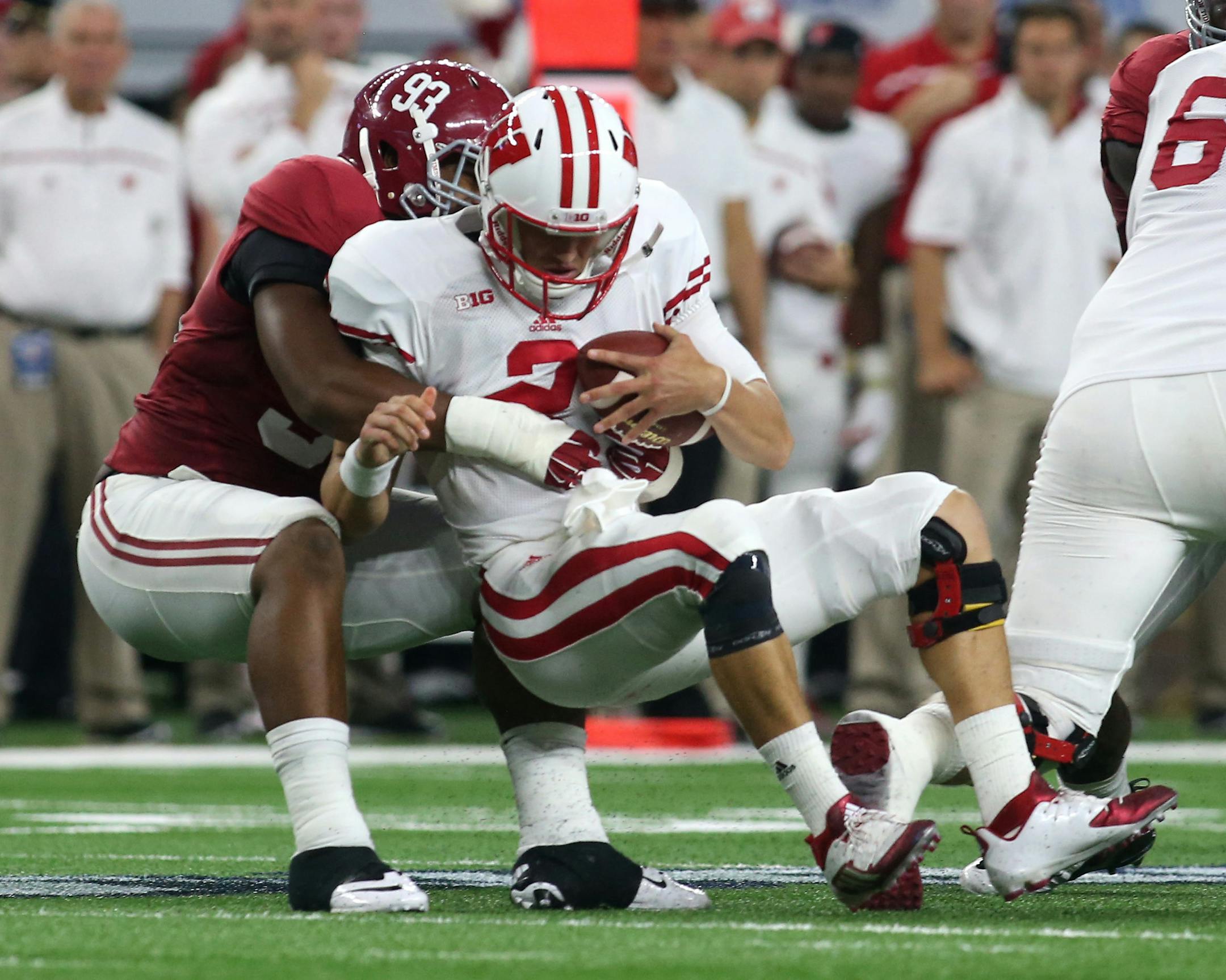 Alabama defensive lineman Jonathan Allen (93) sacks Wisconsin quarterback Joel Stave (2) in the second quarter at the Advocare Classic at AT&T Stadium Saturday, Sept. 5, 2015 in Arlington, Texas. Albama beat Wisconsin 35-17.