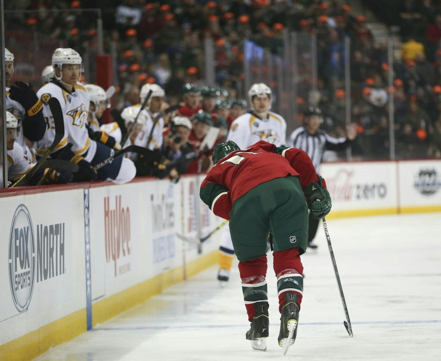 Wild left wing Zach Parise (11) was slow to get off the ice after a hit into the boards in the first period Thursday night.