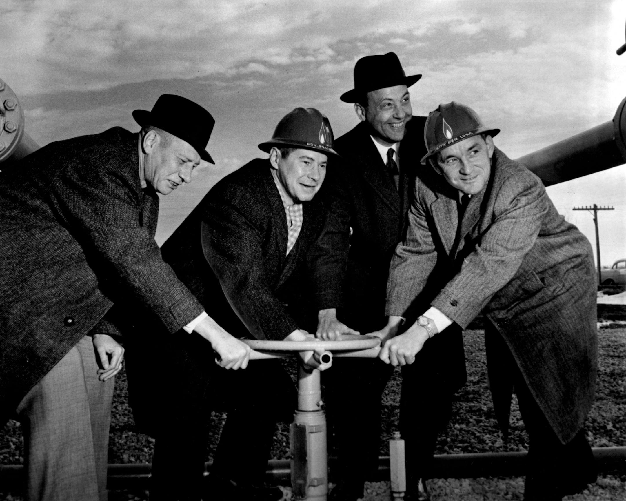 November 11, 1959 Pipeline Opens Ceremonies were held near Farmington, Minn., Tuesday marking completion of natural gas lines from the Twin Cities area to Duluth, Minn., and Siperior, Wis. Among those who took part in the dedication were, from left, E. Clifford Mork, mayor of Duluth; Gov. Freeman; John F. Merriam, president of Northern Natural Gas Co., and Attorney General Miles Lord. The expansion of gas service was made by Northern Natural Gas Co., of Omaha, Neb. November 10, 1959 Marty Nordst