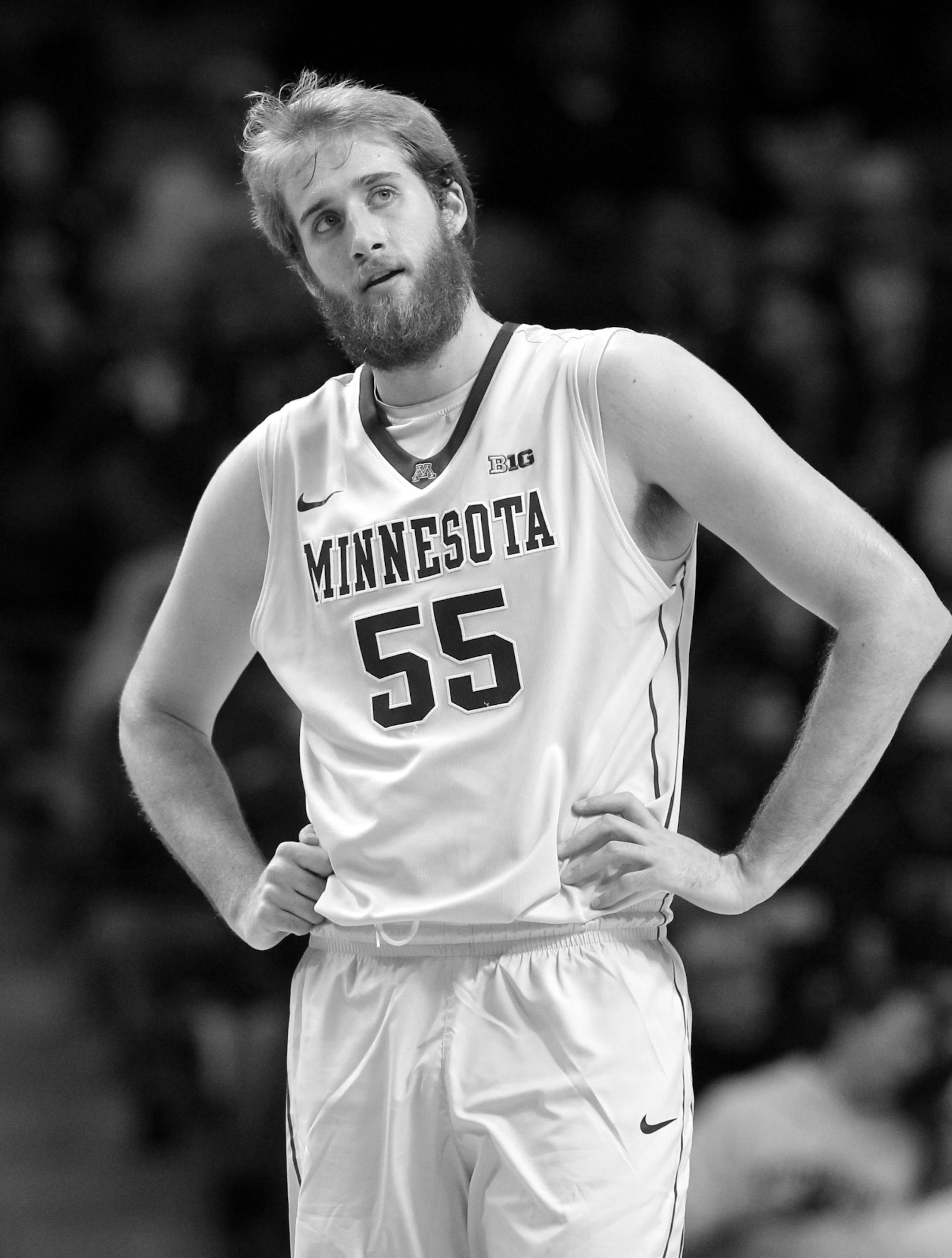 Minnesota center Elliott Eliason (55) reacts to a call during the first half of an NCAA college basketball game against Furman in Minneapolis, Monday, Dec. 22, 2014. (AP Photo/Ann Heisenfelt) ORG XMIT: OTKAH105