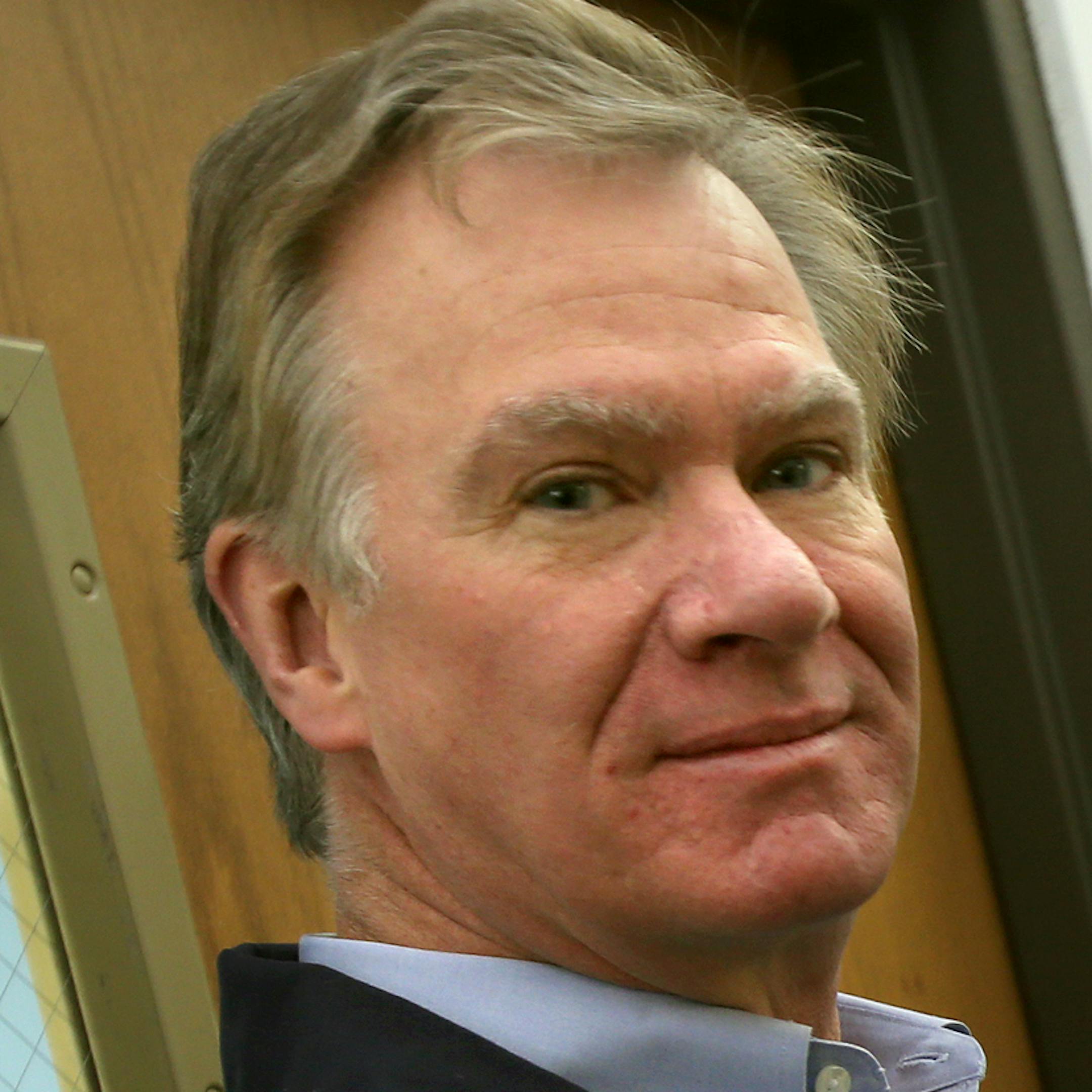 St. Paul Mayor Chris Coleman (left) waits for his son Aidan (casting vote in booth) with his daughter Molly (left at door) and his wife Cindy (black coat) after he cast his ballot. St. Paul Mayor Chris Coleman casts his ballot at the Baker Community Center, 209 W. Page St., St. Paul, MN. November 5, 2013. ] JOELKOYAMA‚Ä¢joel koyama@startribune Coverage of the reelection of St. Paul Mayor Chris Coleman. You will be photographing Coleman when he casts his ballot. Mayor casts ballo