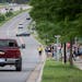 A security guard attempted crowd control last week as cars and motorcycles went up and down Buck Hill Road during a car show in Burnsville.