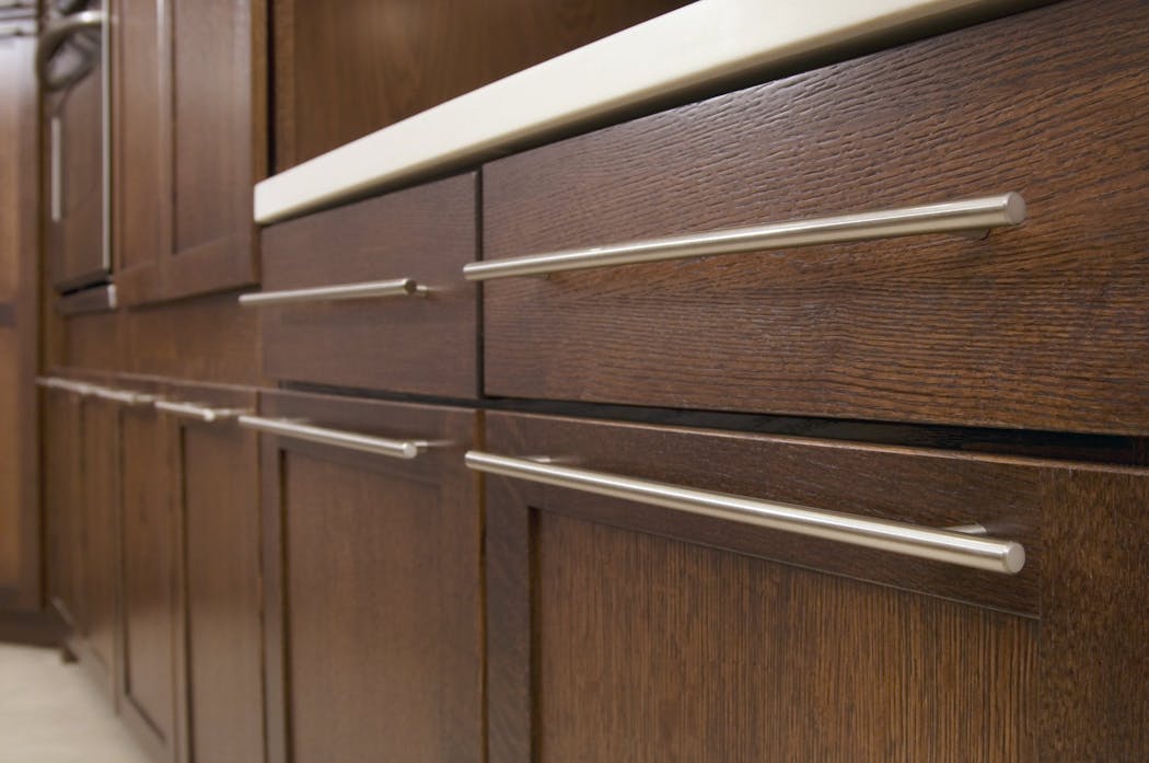 Satin nickel cabinet pulls add a modern touch to traditional drawers.