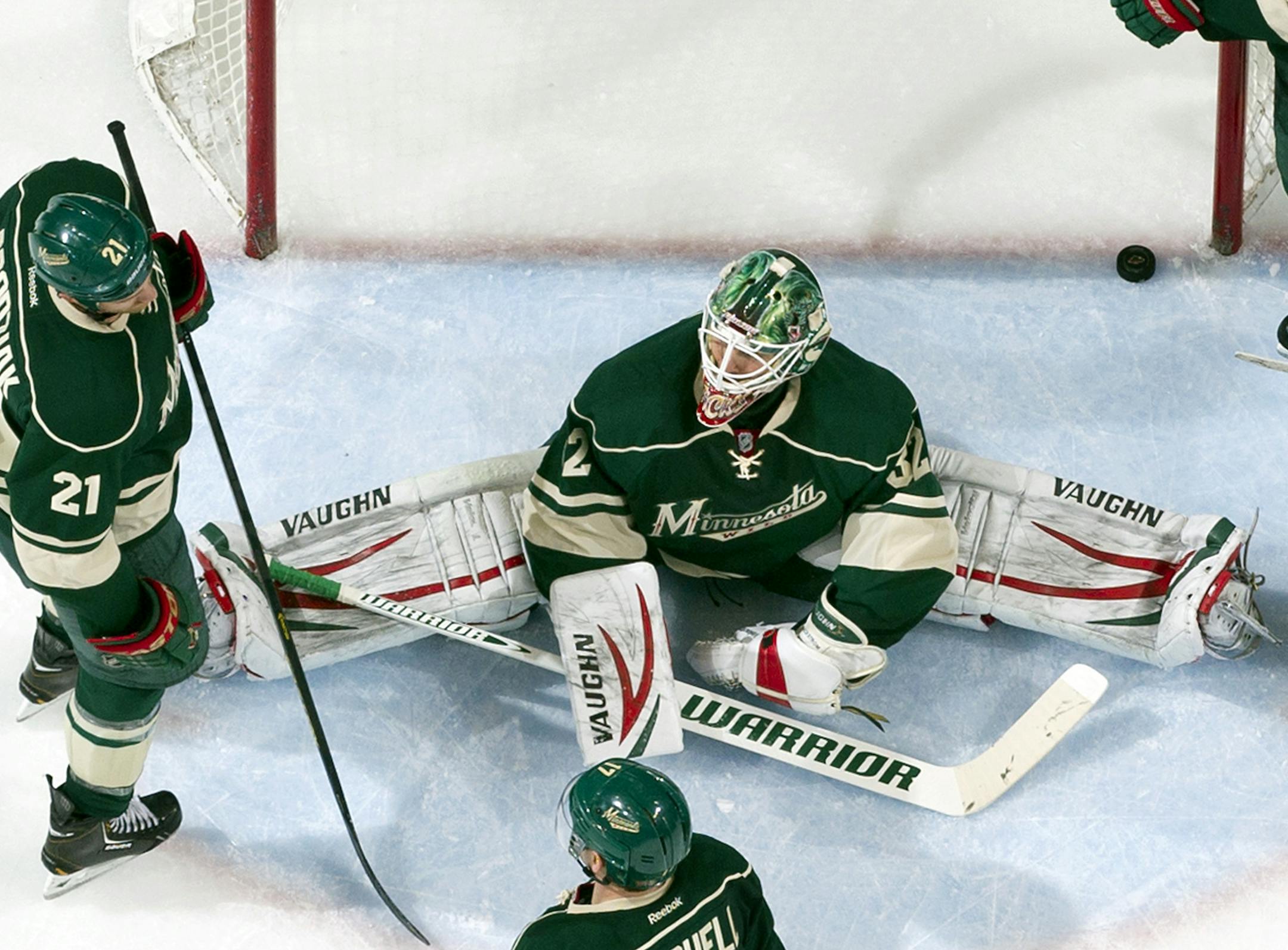 Wild goalie Niklas Backstrom (30) was surrounded by dejected teammates after a goal by Mikael Backlund (11) in the second period. Calgary beat Minnesota by a final score of 4-1. ] CARLOS GONZALEZ cgonzalez@startribune.com April 21, 2013, St. Paul, Minn., Xcel Energy Center, NHL, Minnesota Wild vs. Calgary Flames