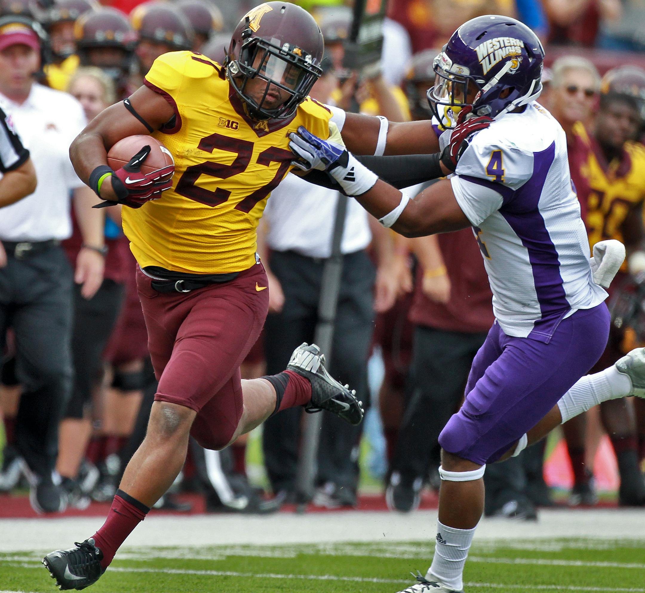 Minnesota Gophers vs. Western Illinois Leathernecks football. Gophers running back David Cobb stiff-armed his way to extra 2nd half yardage. (MARLIN LEVISON/STARTRIBUNE(mlevison@startribune.com)