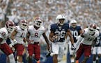 Penn State's Saquon Barkley (26) takes off on a 55-yard touchdown run against Temple during the second half of an NCAA college football game in State 