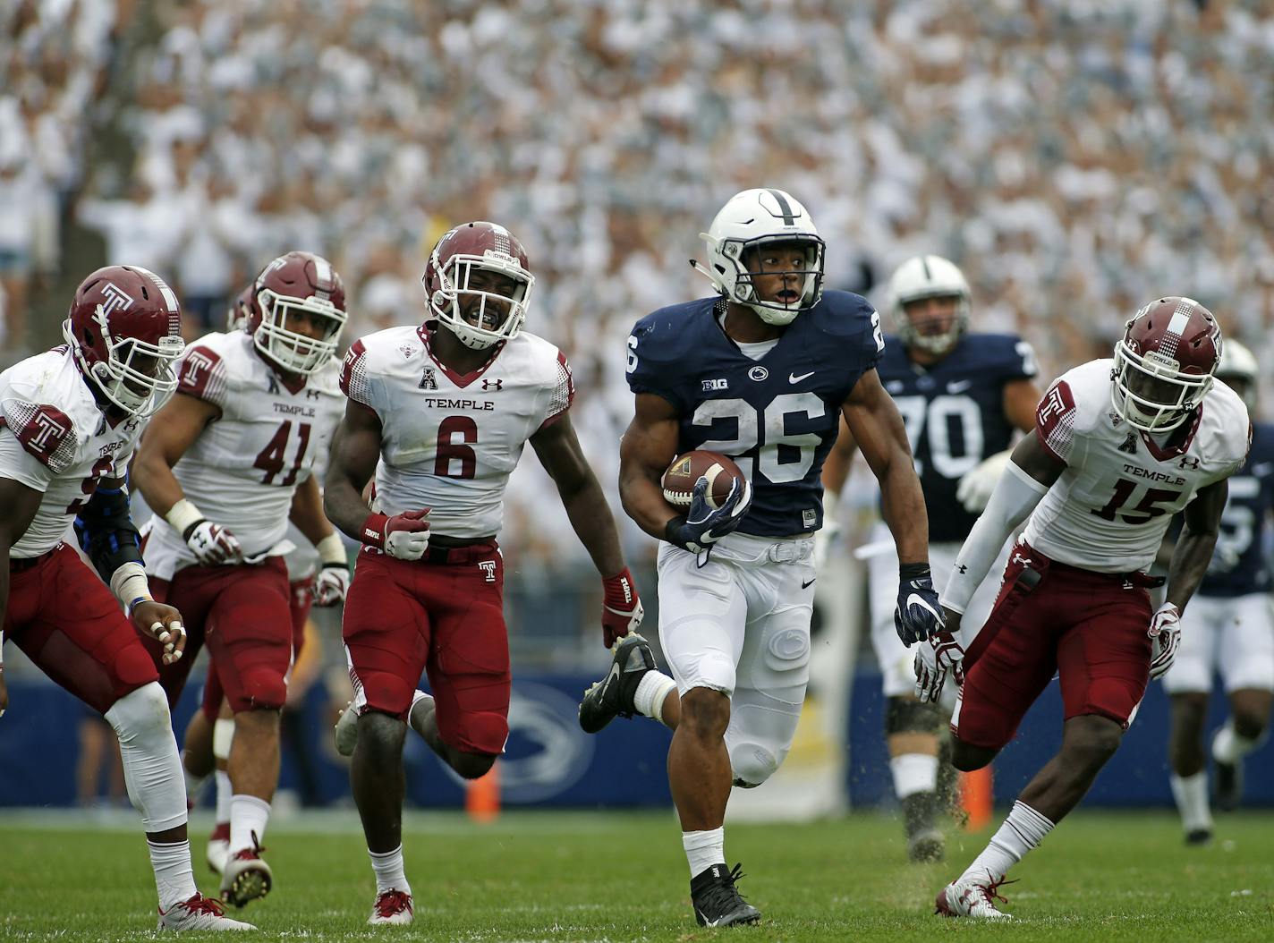 Penn State's Saquon Barkley (26) takes off on a 55-yard touchdown run against Temple during the second half of an NCAA college football game in State College, Pa., Saturday, Sept. 17, 2016. Penn State won the game 34-27. (AP Photo/Chris Knight)