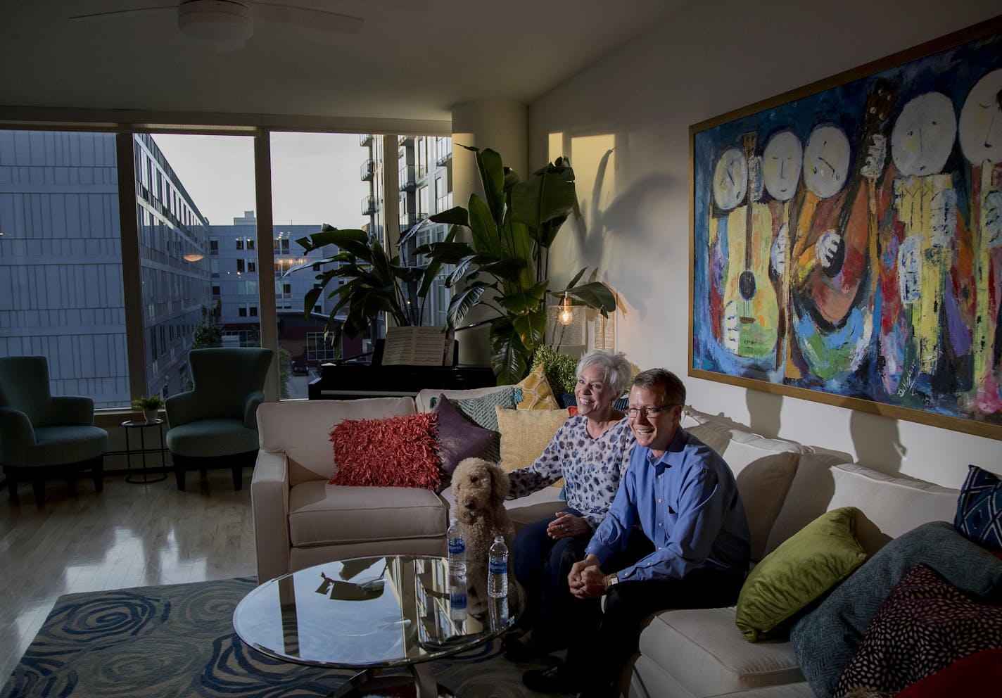 Kim and Sam Thompson their Minneapolis condo. ] CARLOS GONZALEZ &#x2022; cgonzalez@startribune.com - October 19, 2017, Minneapolis, MN, Empty nesters are selling the big suburban houses where they raised their kids, choosing downtown condos where they can live like millennial. - Sam and Kim Thompson