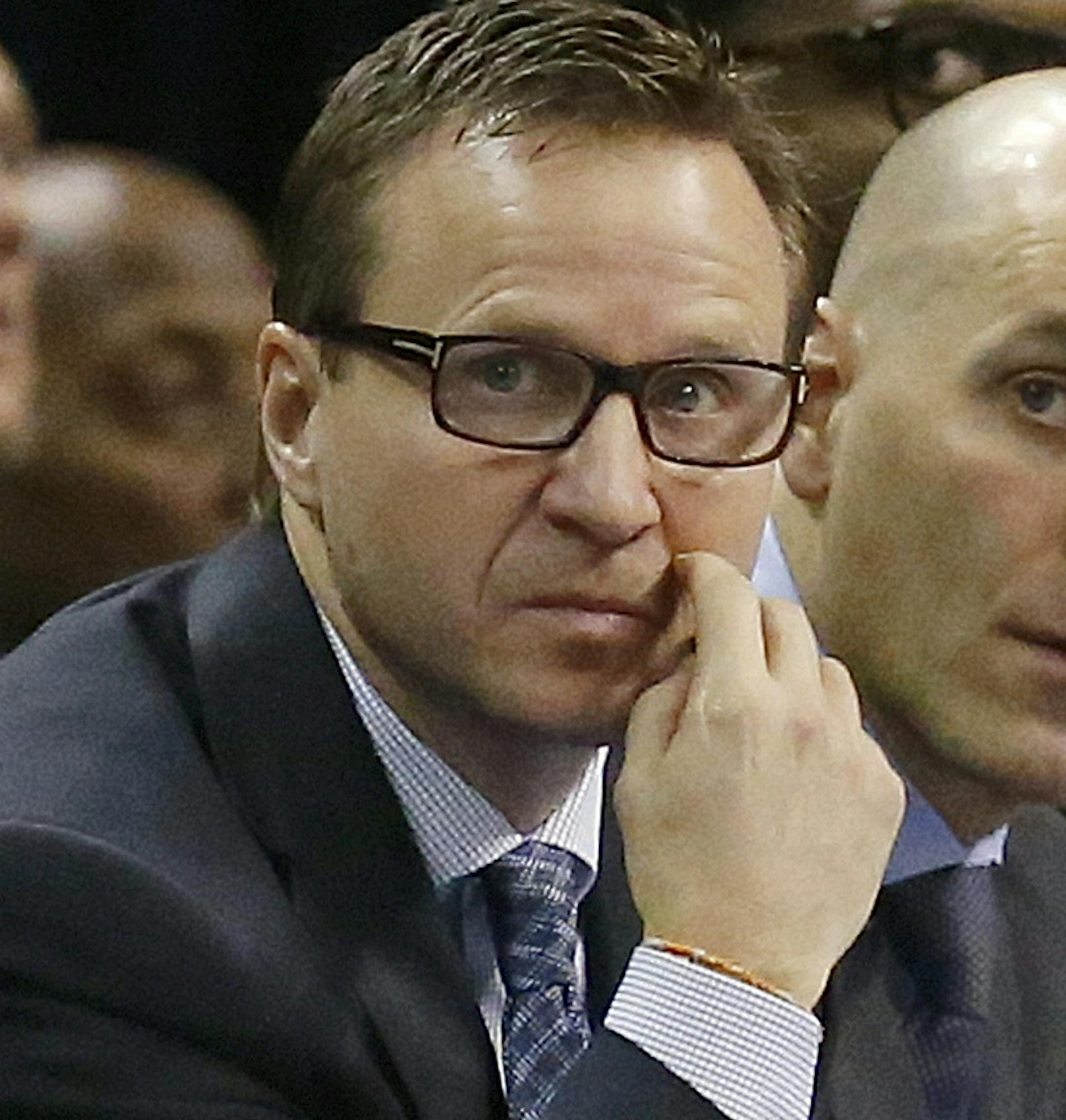 FILE - In this Jan. 9, 2015, file photo, Oklahoma City Thunder head coach Scott Brooks, left, and assistant coaches Rex Kalamian, center, and Robert Pack, right, watch from the bench in the second quarter of an NBA basketball game against the Utah Jazz in Oklahoma City, The Thunder fired Brooks on Wednesday, April 22, 2015. (AP Photo/Sue Ogrocki, File)