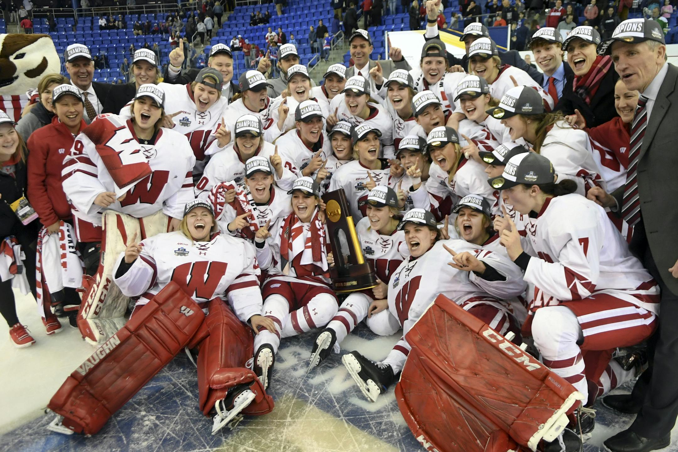 Wisconsin team members gather for photos after the team's 2-0 win over Minnesota to win the NCAA Division I women's Frozen Four hockey championship Sunday, March 24, 2019, in Hamden, Conn. (AP Photo/Stephen Dunn)