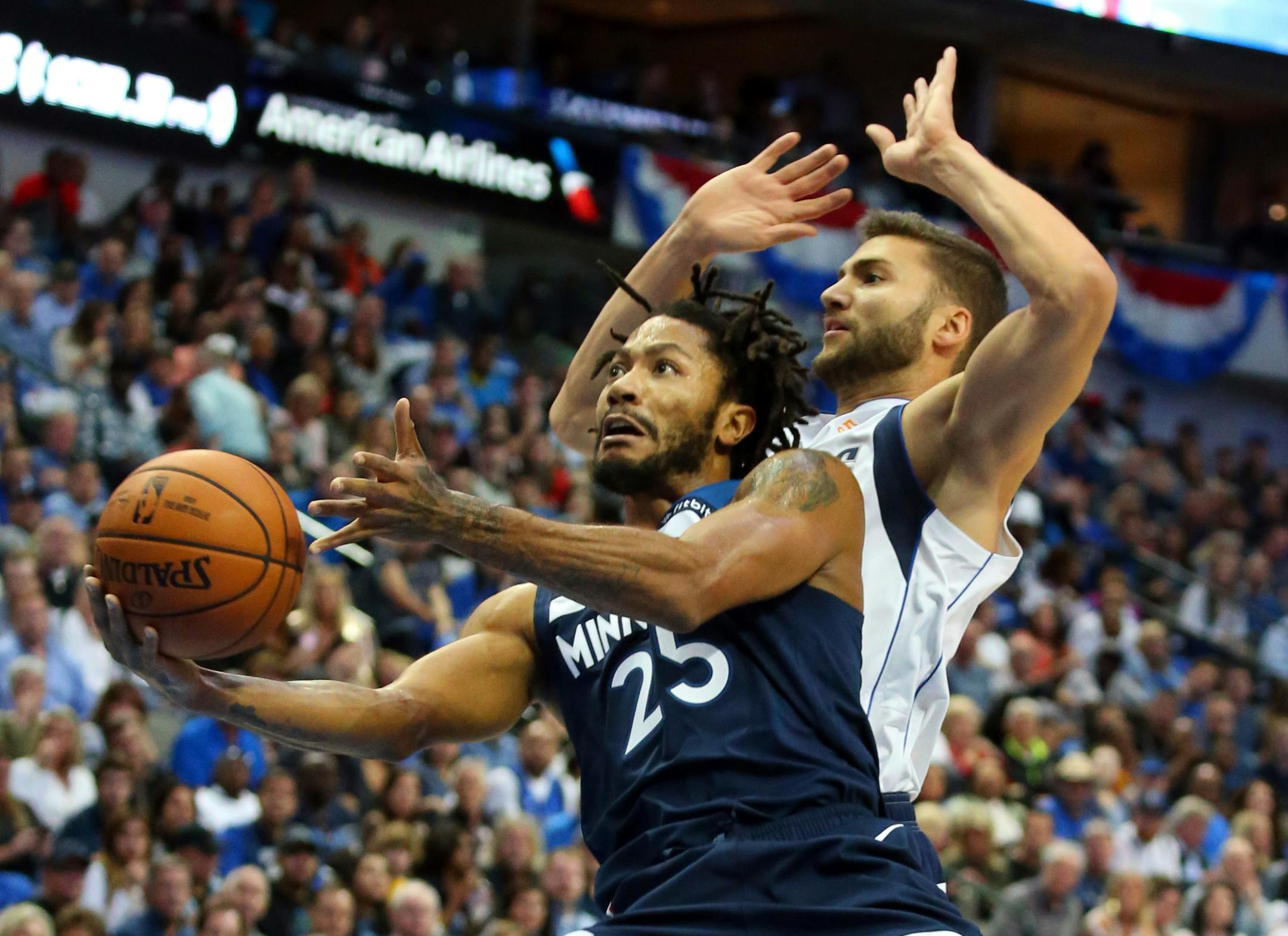Timberwolves guard Derrick Rose goes up for a shot against Mavericks forward Maximilian Kleber in the first half