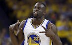 FILE - In this April 27, 2016, file photo, Golden State Warriors' Draymond Green celebrates after scoring against the Houston Rockets during the first