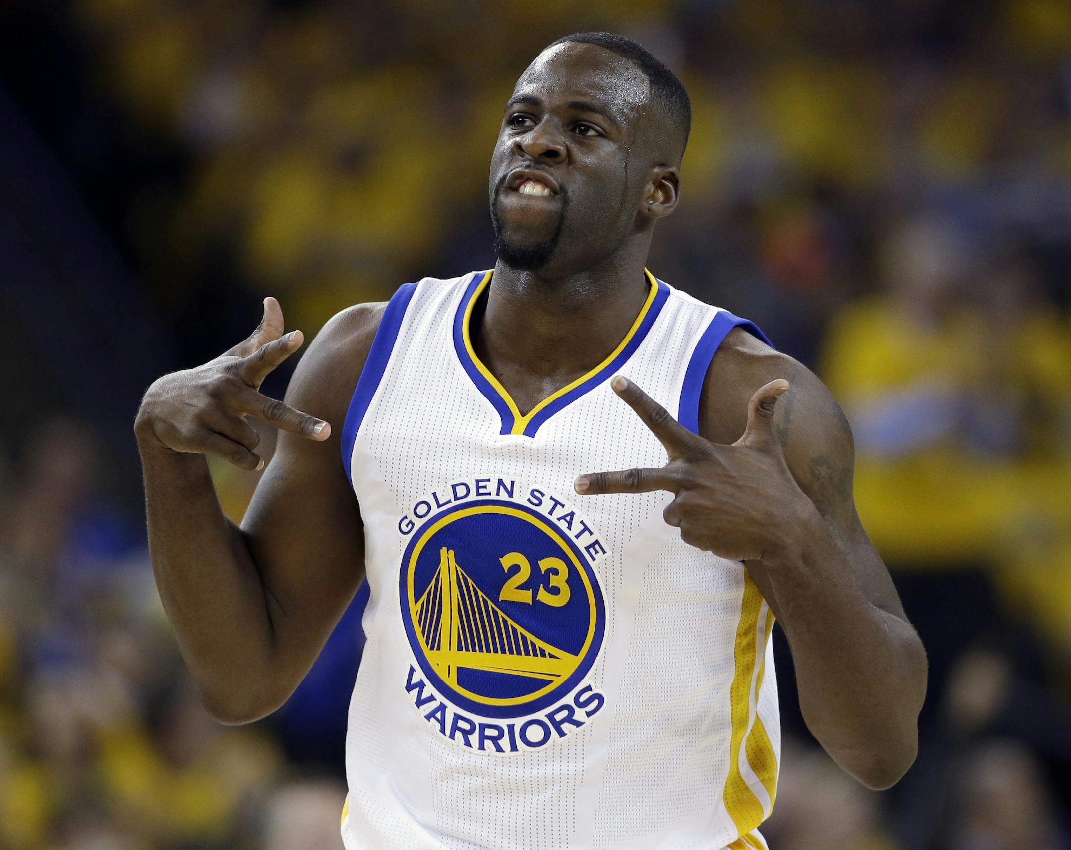 FILE - In this April 27, 2016, file photo, Golden State Warriors' Draymond Green celebrates after scoring against the Houston Rockets during the first half in Game 5 of a first-round NBA basketball playoff series, in Oakland, Calif. Green was arrested for an alleged assault over the weekend in East Lansing, Michigan, according to online court records. The incident occurred around 2:30 a.m. Sunday, July 10, 2016, in the city where Green played for Michigan State from 2008-12. (AP Photo/Marcio Jos