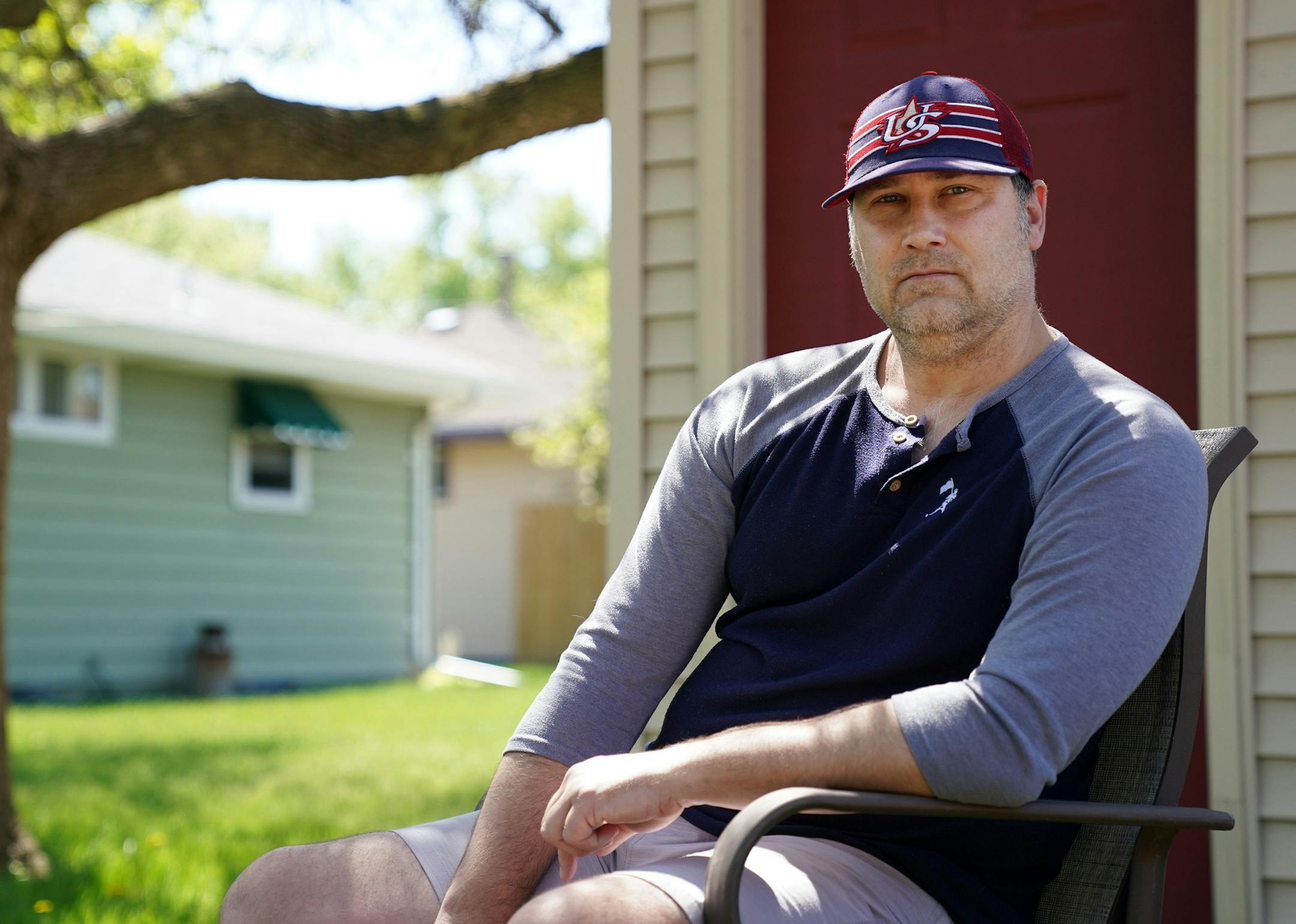 Brian Hronski, who was laid off in April from his job of 16 years working as the recreation supervisor for the city of Lino Lakes, sat for a portrait in his backyard Wednesday. ] ANTHONY SOUFFLE • anthony.souffle@startribune.com Brian Hronski, who was laid off in April from his job of 16 years working as the recreation supervisor for the city of Lino Lakes, sat for a portrait in his backyard Wednesday, May 20, 2020 in Columbia Heights, Minn. The city cited COVID-19 as the reasoning for abolishin