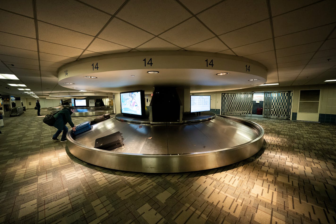 The baggage claim at the Minneapolis-St. Paul International Airport is in the midst of a multimillion-dollar overhaul. Passengers collect their bags from small and dimly lit baggage carousels, which will be replaced by a brighter larger baggage area.