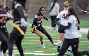 Iyona Smith, (7) of Camden High scored a first half touchdown on Roosevelt High defense during the inaugural high school girls flag football league on